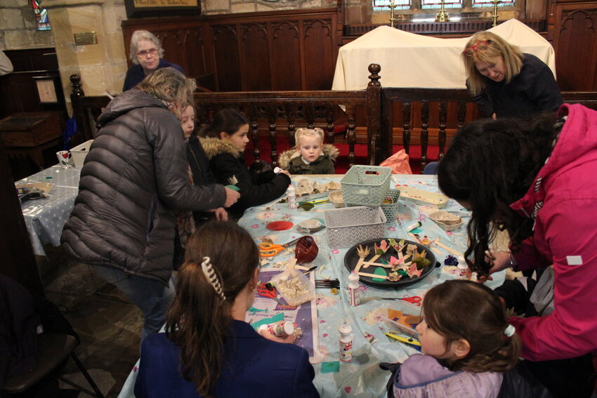 Image of Afterschool craft and snacks family activity session in church for Mother's Day.